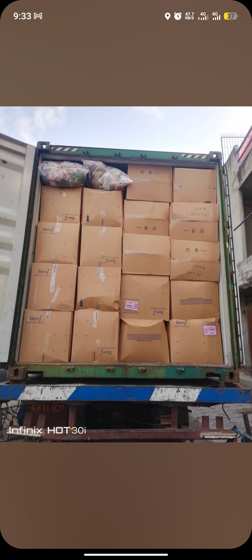 Container loaded with cartons of second-hand clothing
