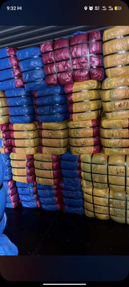 Container of UK and Canada okrika bales being unloaded for sorting
